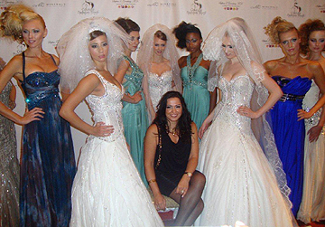 Fashion designer Mireille Dagher and models pose on the red carpet at Couture fashion Week New York